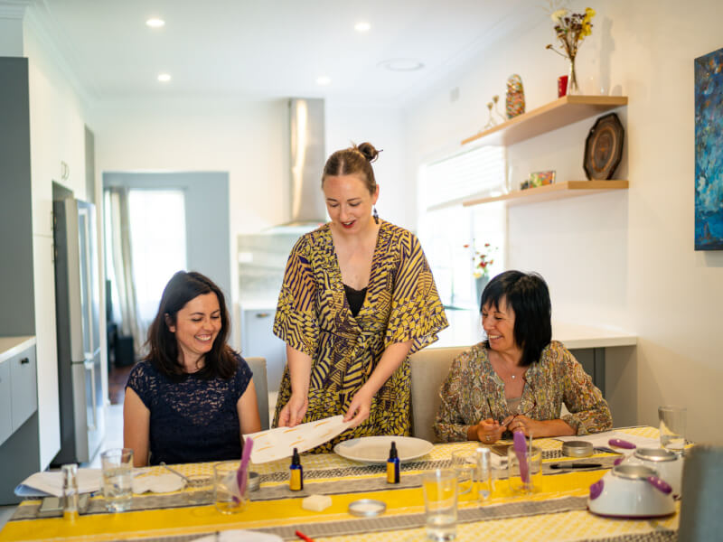 Teacher demonstrating their craft to students at a skincare making class
